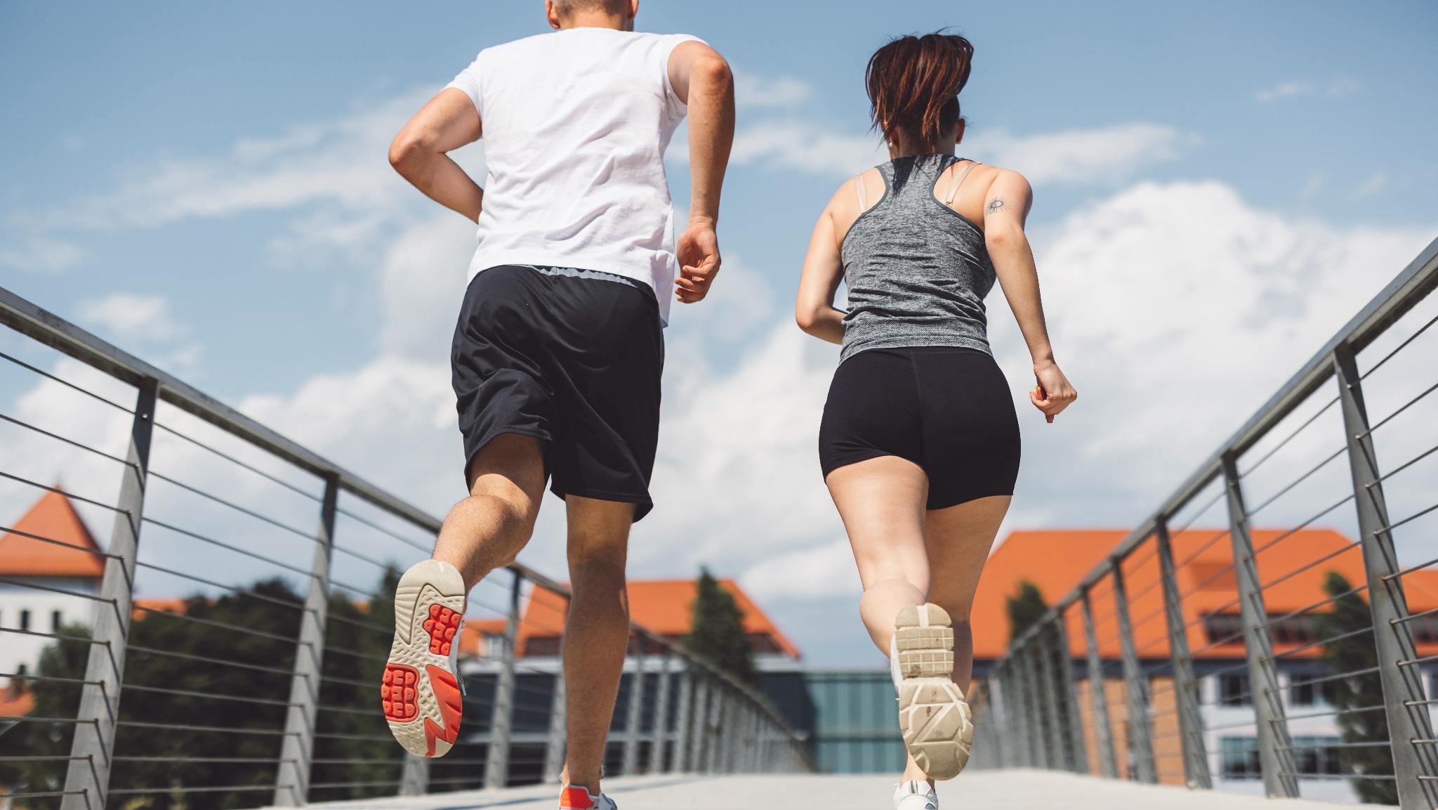 Active lifestyle recovery concept showing runners on bridge after wound healing