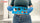 Person holding a stoma measuring guide to measure stoma size before cutting a wafer opening